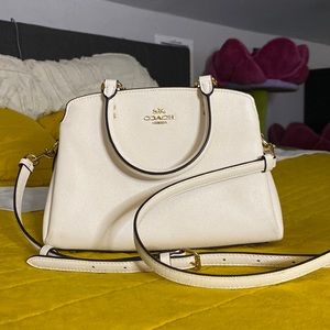 Small white coach purse with gold details